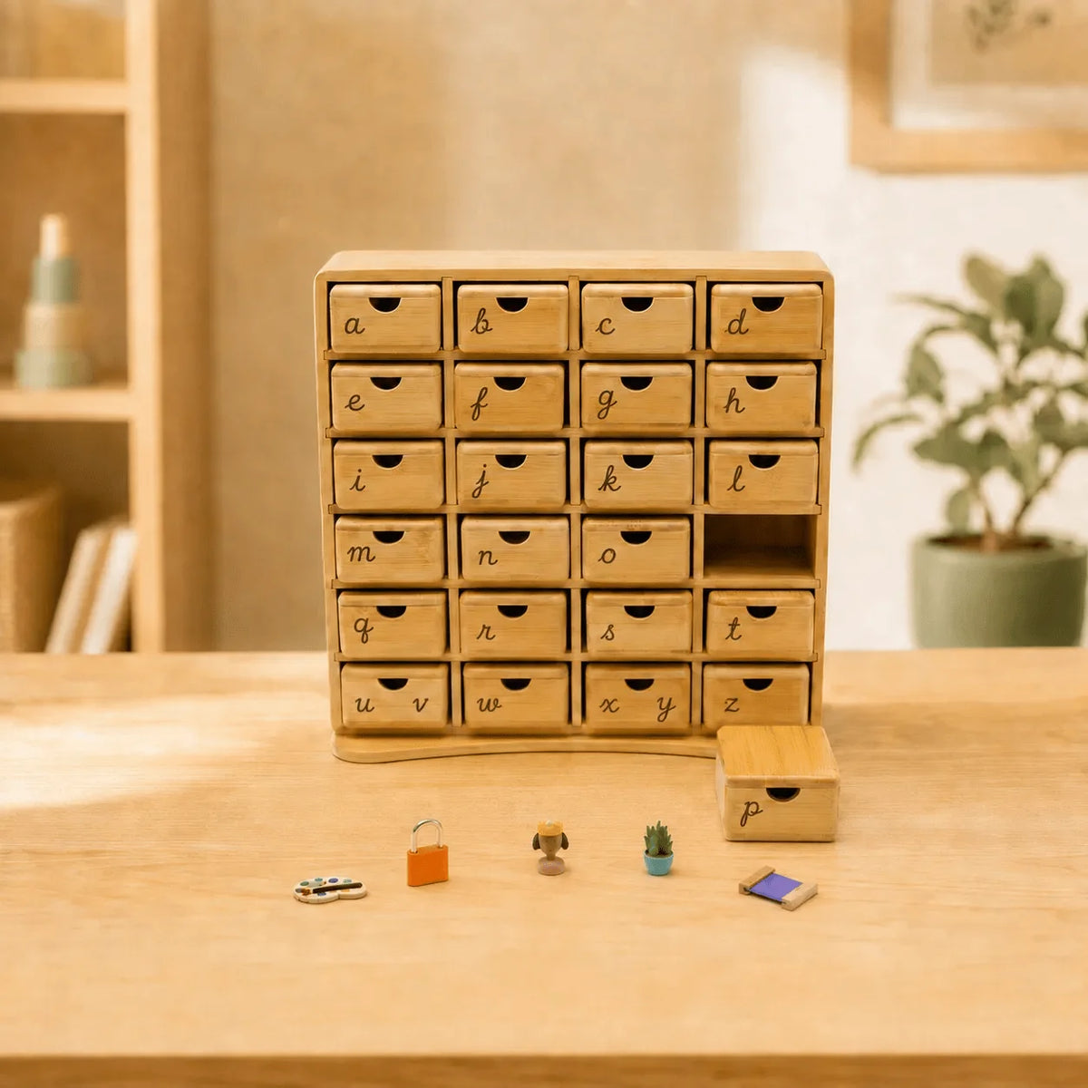 Montessori phonics cabinet in cursive lettering version with small miniature learning objects